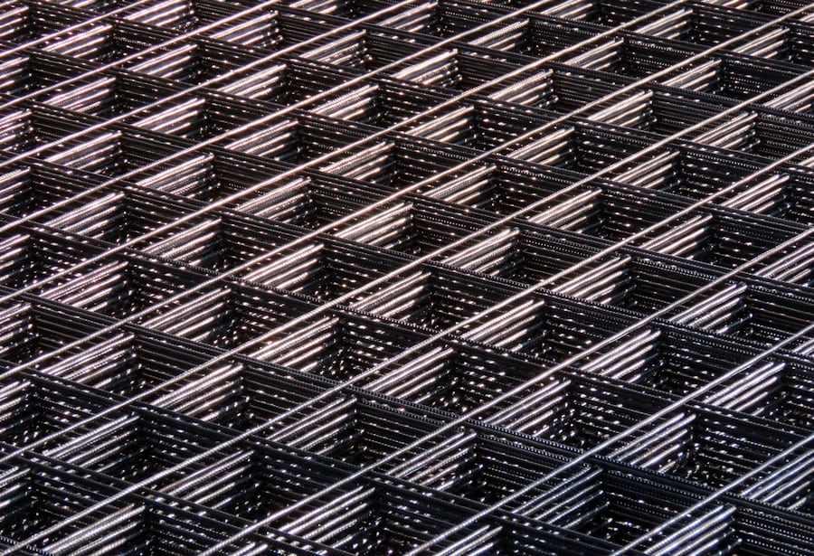 Reinforcing mesh being installed in a foundation